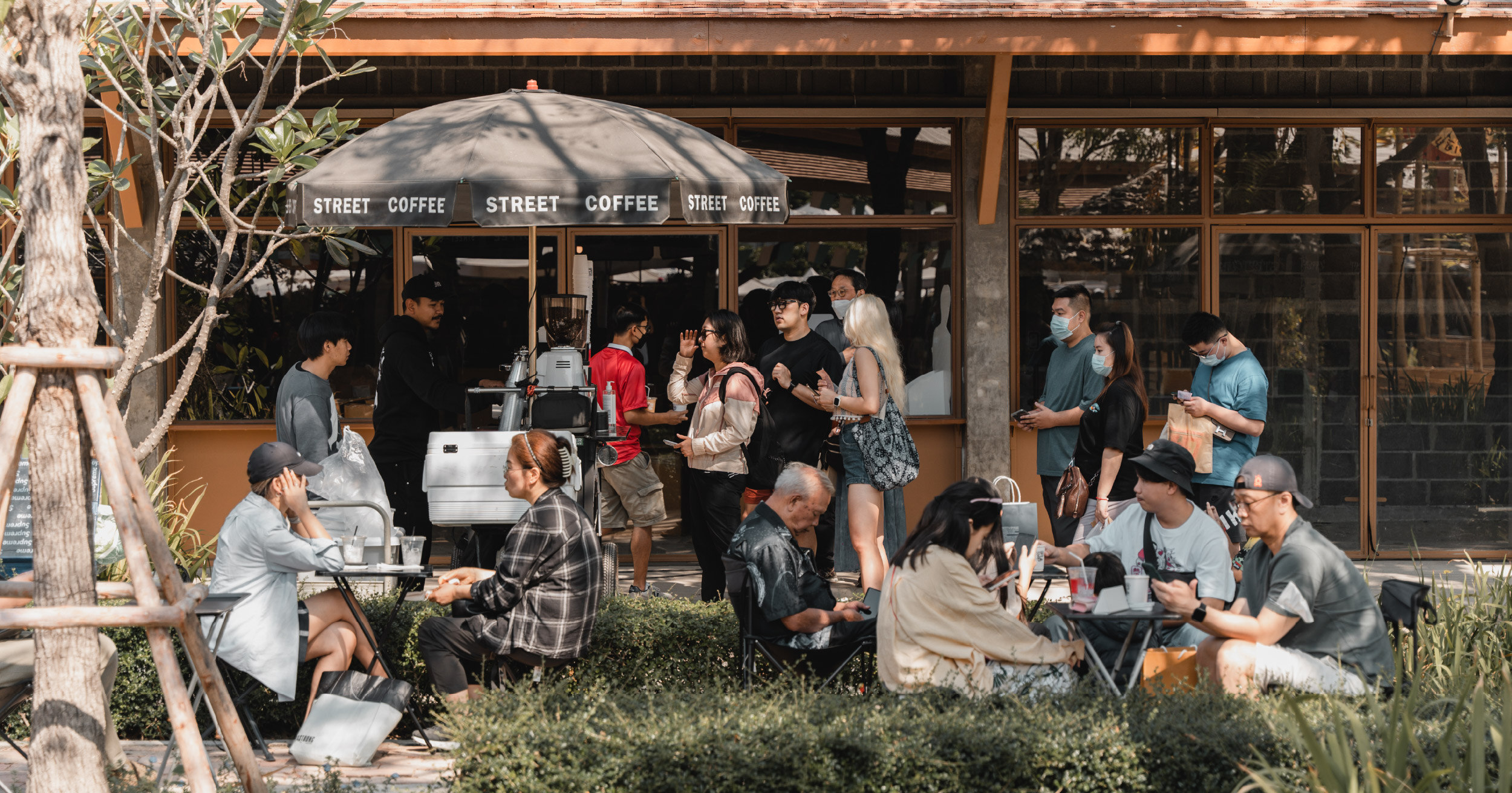 Small business owner celebrating growth from customer referrals, not ads